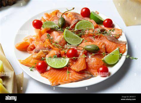 image: assiette saumon fumé entrée colorée avec pamplemousse et herbes