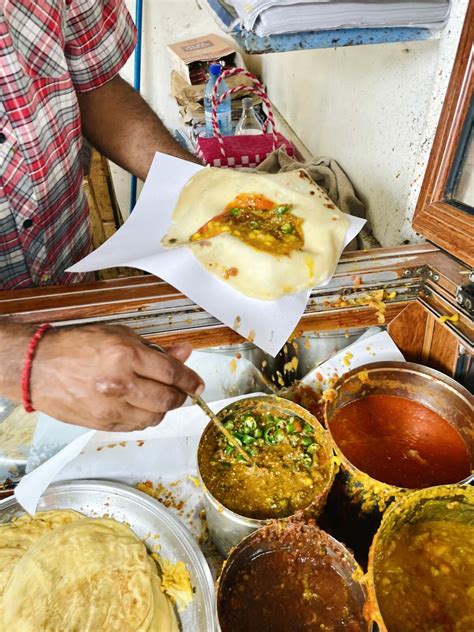 Street food vendor in Mauritius preparing roti