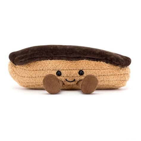 Une peluche Éclair Étienne de Jellycat, avec son glaçage chocolat et ses bottes en velours côtelé